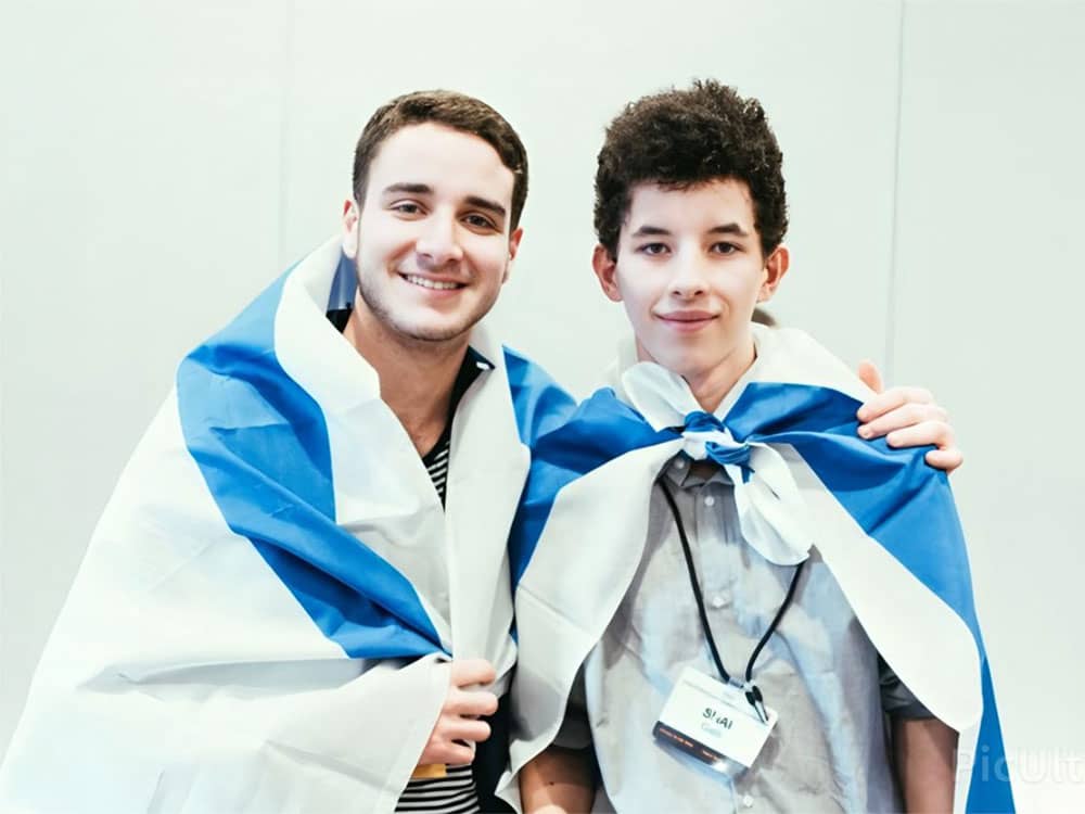 Two Club Z teens wrapped in Israeli flags